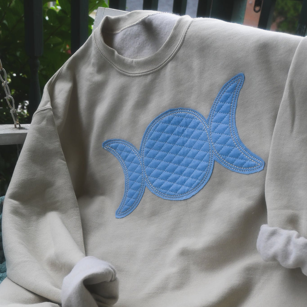 triple moon crewneck